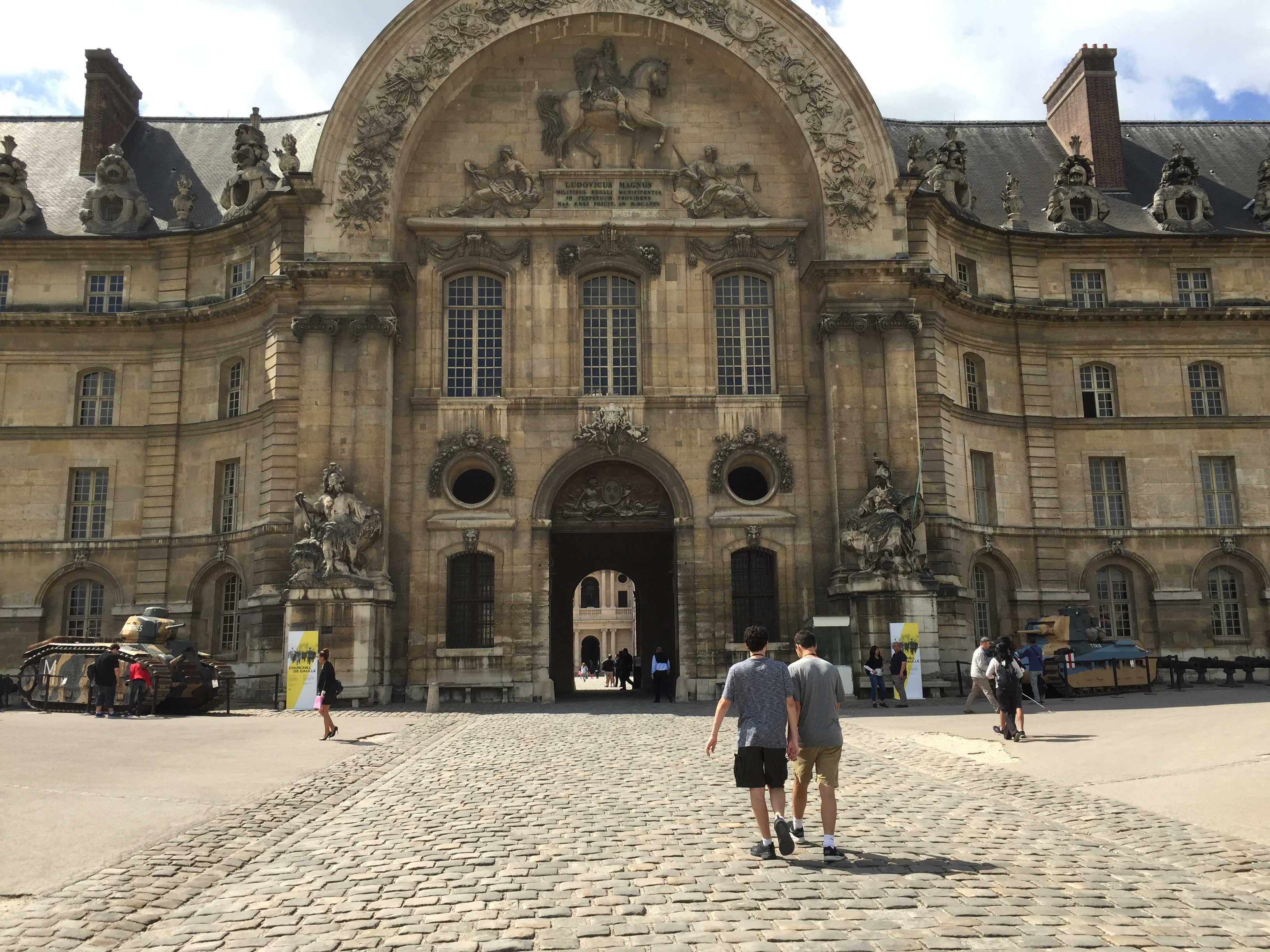 Teen cousins walking into Place des Invalides in Paris